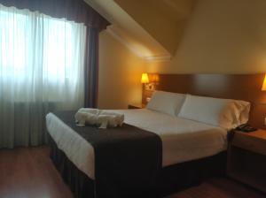Кровать или кровати в номере Hotel Avión by Bossh! Hotels