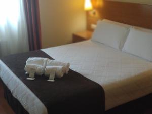 Кровать или кровати в номере Hotel Avión by Bossh! Hotels