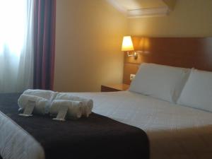 Кровать или кровати в номере Hotel Avión by Bossh! Hotels