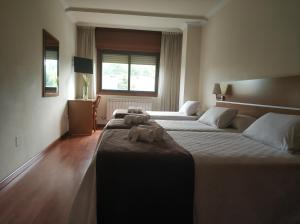 Кровать или кровати в номере Hotel Avión by Bossh! Hotels