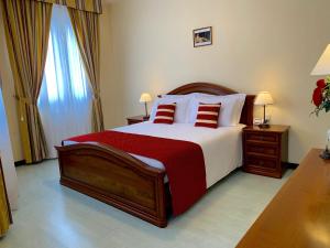 A bed or beds in a room at Albergo Italia