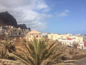 a view of a city with buildings and palm trees at Sissi's B&B in Ponta do Sol