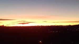 The sunrise or sunset as seen from a panziókat or nearby