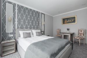 Postel nebo postele na pokoji v ubytování Mon Ami Hotel