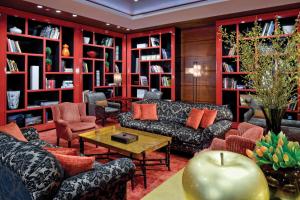 a living room with couches and bookshelves at The Bostonian Boston in Boston