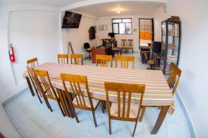 a dining room with a table and chairs at La Casa de Los Balcones in Chachapoyas