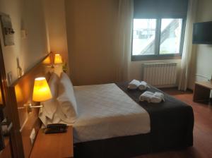 Кровать или кровати в номере Hotel Avión by Bossh! Hotels