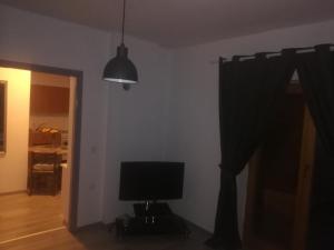 a room with a computer monitor and a window at Apartmani Marin in Vukovar