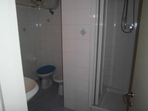 a bathroom with a shower and a toilet and a sink at due passi dal mare in San Benedetto del Tronto