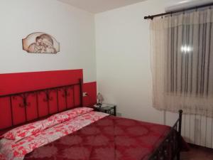 A bed or beds in a room at La Sorgente Del Subasio ASSISI