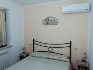 A bed or beds in a room at La Sorgente Del Subasio ASSISI
