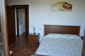 A bed or beds in a room at La Sorgente Del Subasio ASSISI