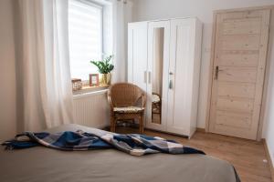 Posteľ alebo postele v izbe v ubytovaní Apartament NOTI Gdynia z parkingiem