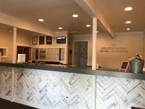 a lobby of a library with a reception counter at Golden Haven Hot Springs in Calistoga