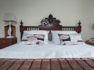 En eller flere senge i et værelse på Casa da American Cable Company