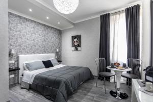 Postel nebo postele na pokoji v ubytování B&B Notti d'Oriente