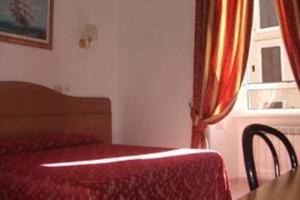Postel nebo postele na pokoji v ubytování Hotel Euro Quiris