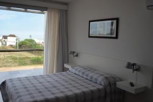 Ein Bett oder Betten in einem Zimmer der Unterkunft Brisas del Rivero