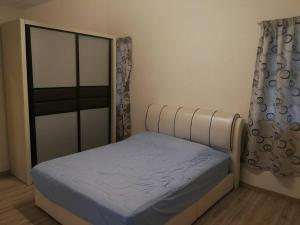 Un pat sau paturi într-o cameră la The Haven Retreat B7-2-1 ( Silverpark)