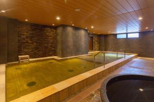 a large pool of water in a room with at Hot Spring from Deep Water Osaka Hinode Hotel Nipponbashi in Osaka