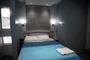 Postel nebo postele na pokoji v ubytování Hotel Ciudad Latin Palace