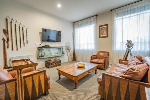 a living room with a couch and a table at Poshtel in Oamaru