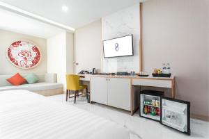 Postel nebo postele na pokoji v ubytování The 8 Hotel Udonthani