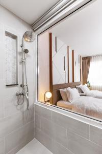 Postel nebo postele na pokoji v ubytování The 8 Hotel Udonthani