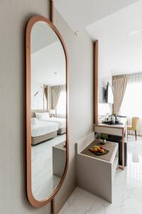 Postel nebo postele na pokoji v ubytování The 8 Hotel Udonthani