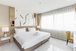 Postel nebo postele na pokoji v ubytování The 8 Hotel Udonthani