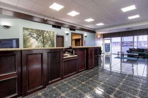 a lobby with a bar in a building at Econo Lodge Kingsville in Kingsville