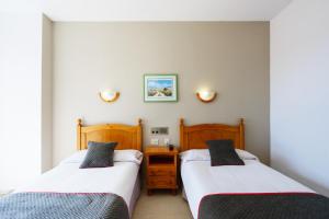 En eller flere senge i et værelse på Hotel Costa Andaluza