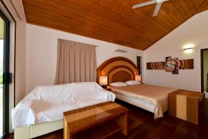 Postel nebo postele na pokoji v ubytování Hotel Paradis d'Ouvéa