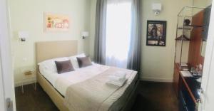 Letto o letti in una camera di Piazza Venezia Grand Suite