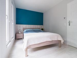 Posteľ alebo postele v izbe v ubytovaní Parkova Apartamenty