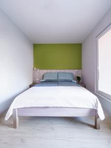 Posteľ alebo postele v izbe v ubytovaní Parkova Apartamenty