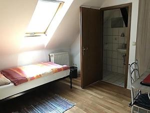 Postel nebo postele na pokoji v ubytování Pension Zentrum Riesa