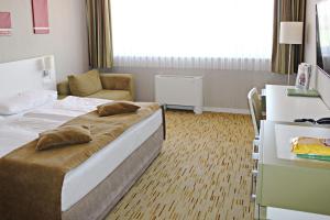 Posteľ alebo postele v izbe v ubytovaní Hotel EMPIRE