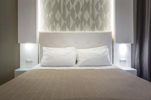 A bed or beds in a room at Blu Notte Guest House