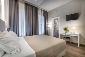 A bed or beds in a room at Blu Notte Guest House