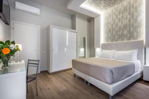 A bed or beds in a room at Blu Notte Guest House