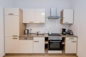 Η κουζίνα ή μικρή κουζίνα στο Leer Innenstadt 1