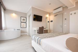 Posteľ alebo postele v izbe v ubytovaní Hotel Oliveto