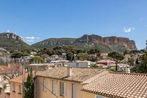 a view of a city with mountains in the background at La Cassidaine in Cassis