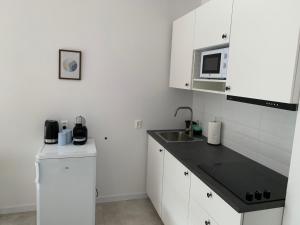 Kuchyň nebo kuchyňský kout v ubytování Apartament w Centrum