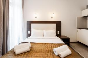 Postel nebo postele na pokoji v ubytování Happy Inn