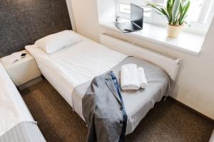 Postel nebo postele na pokoji v ubytování Happy Inn