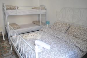 Postel nebo postele na pokoji v ubytování Sunrise Hostel & Rooms