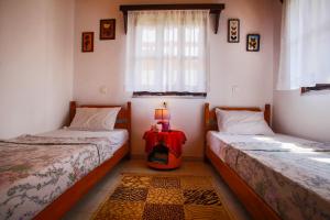 A bed or beds in a room at Villa Achilleas