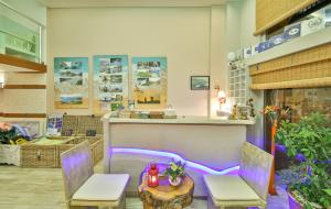 a store with a counter with two chairs and a table at Hotel Sonne - Adults Only in Kaş